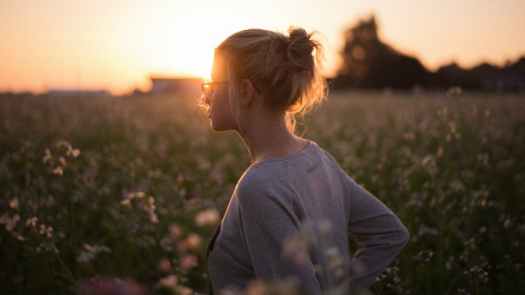 Girl in Meadow Sunset Contemplating